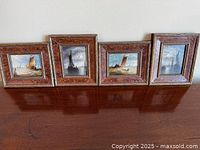 Group shot of four framed miniature sailing boat paintings