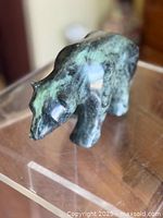 Top view of green stone bear carving