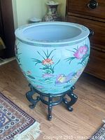 Full view of fishbowl on stand