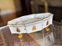 Top perspective of octagonal Limoges dish showing gold bee motif and feet