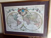 Full view of framed Mappemonde world map print showing mat and frame