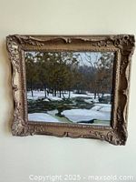 Framed George Thomson oil on board painting hanging on wall