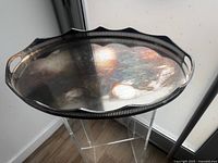 Top view of oval silver-plated tray showing pierced gallery and handles