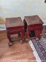 Pair of red lacquer square stools front view