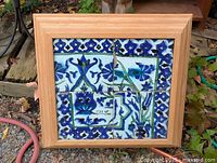 Full view of framed four-tile panel showing design and frame