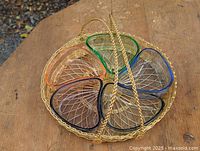 Top view of wire basket holding six colored triangular glass dishes
