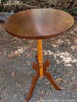 Full view of pedestal side table outdoors