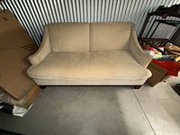 Front view of beige fabric sofa
