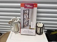 Boxed Better Homes & Gardens 3-cup wall votive holder, white lantern, bronze candle holder with candles