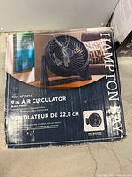 Front of boxed Hampton Bay 9-inch air circulator showing product image and branding