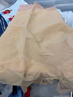 Front view of nude/beige shapewear showing fabric and discoloration