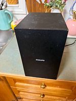 Front view of Philips subwoofer black cabinet