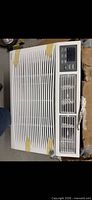 Top view of air conditioner showing full front grille, control panel and vents