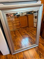 Front view of silver framed mirror