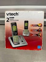 Retail box showing VTech CS6619-2 cordless phone with two handsets and base