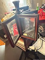 Overall view of rotating wooden photo frame with panels open