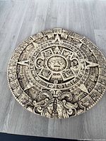 Full view of circular Aztec calendar wall plaque