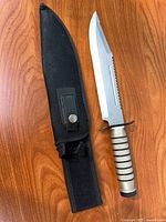 Knife and sheath laid flat showing overall design