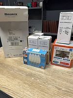 Group shot of all six boxed lighting items on table