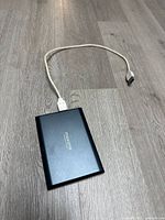 Top view of hard drive connected to USB cable