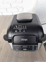 Front view showing Ninja branding, digital control panel and overall exterior