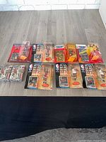 Overall view of all sealed figures and card boxes on table