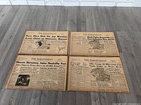 All four newspapers laid out showing complete front pages