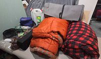 Overall lot with sleeping bags, foam pad, water jugs and accessories