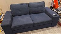 Front view of Ikea Kivik loveseat showing overall design and condition