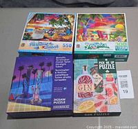 Group shot of four puzzle boxes showing titles and piece counts