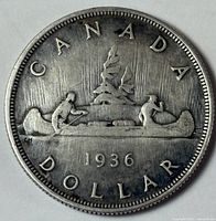 Reverse of 1936 Canadian silver dollar showing Voyageur design