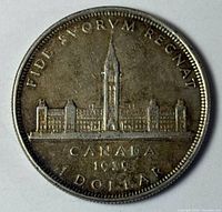 Reverse of 1939 Canadian silver dollar showing Parliament design and inscriptions