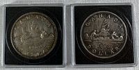 Obverse of both 1960 Canada silver dollars in holders