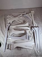 Overview of mixed-size white metal brackets