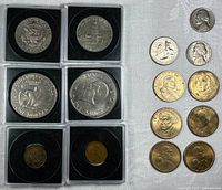 Overall view showing six encapsulated coins and eight loose coins
