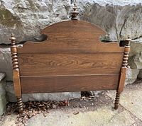 Full view of oak headboard with posts and finials