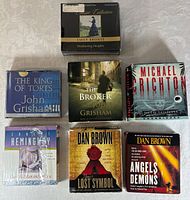 Front view of seven audiobook CD box sets