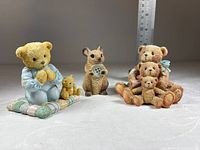 Front view of all three figurines