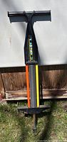 Black pogo stick with spring and coloured panels