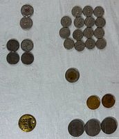 Overview of entire coin lot and brass tag