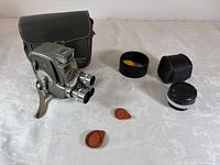 Camera, bag, auxiliary lens, lens hood with filter, lens caps