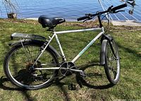 Full side view of white Bianchi Kalahari bike with rack and fenders