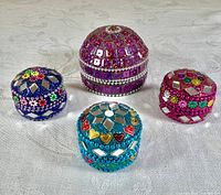 Four beaded mosaic round trinket boxes in various colours