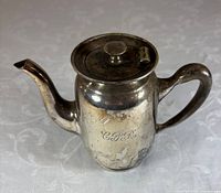 Front view showing CPR engraving, spout, handle and lid