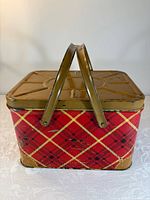 Closed basket front and top view showing plaid pattern, handles, lid