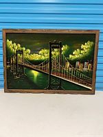 Front view of wooden frame with backing and visible inserted artwork