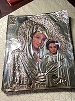 Front view of icon with silver oklad and painted faces