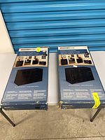 Two boxed ClosetMaid 15-cube organizers on table