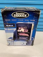 Front of retail box showing Smokin' Sidekick branding and product image