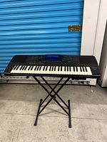 Keyboard on X-style stand, full view